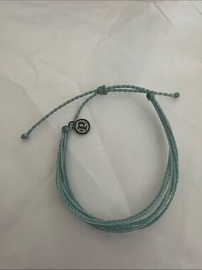 NWOT Pura Vida Aqua Woven String Bracelet with Round Logo Charm